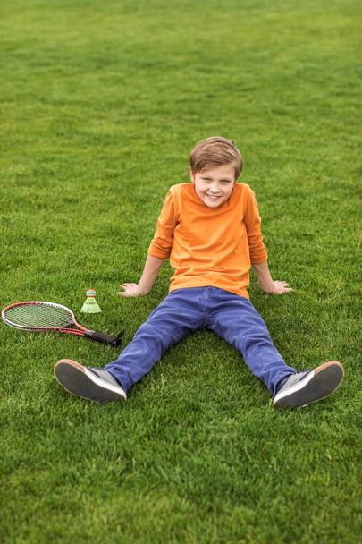 boy with badminton equipment  - Foto, afbeelding