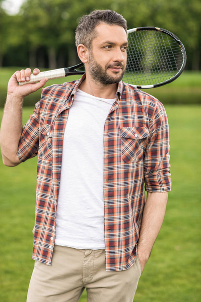 man holding badminton racket  - Photo, Image