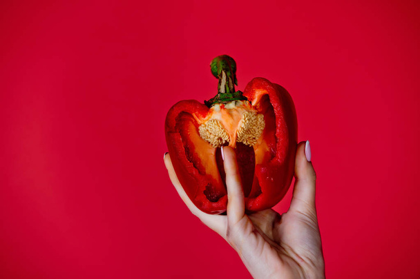 healthcare and vitamin, hand of woman hold sweet bell pepper - Foto, afbeelding