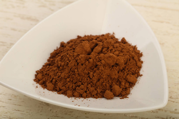 Какао-порошок у мисці
 - Фото, зображення