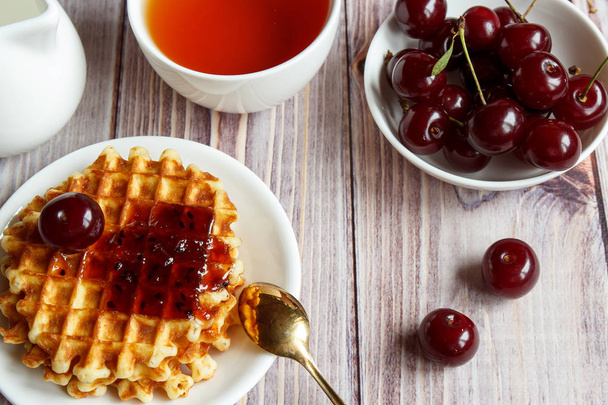 Tasty and healthy breakfast: waffles with fruit jam - Фото, зображення