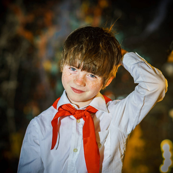 Redhead attractive boy dressed like soviet pioneer with red tie - Foto, immagini