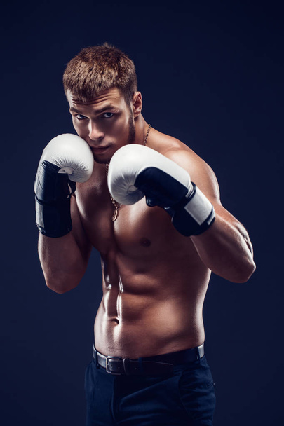 Aggressive shirtless boxer on grey background. - Φωτογραφία, εικόνα