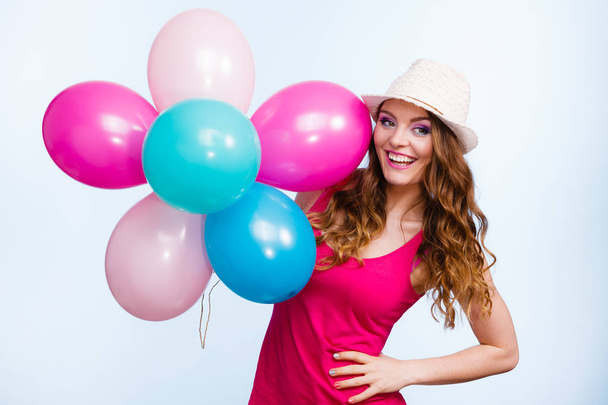 Woman playing with many colorful balloons - Photo, Image