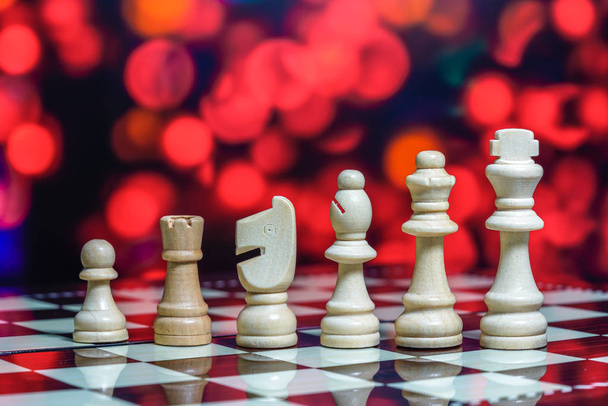 Chess pieces on board with bokeh background - Photo, Image