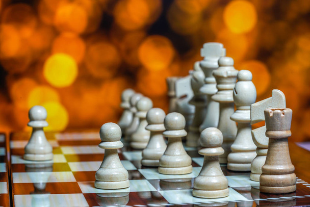 Chess pieces on board with bokeh background - Photo, Image