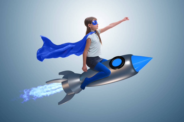 Маленька дівчинка літає ракетою в концепції супергероя
 - Фото, зображення