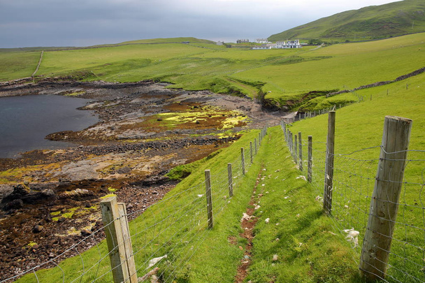 A coastal path leading to the colorful beach of Duntulm Bay in the northern part of the Trotternish peninsula, Isle of Skye, Highlands, Scotland, UK - Valokuva, kuva