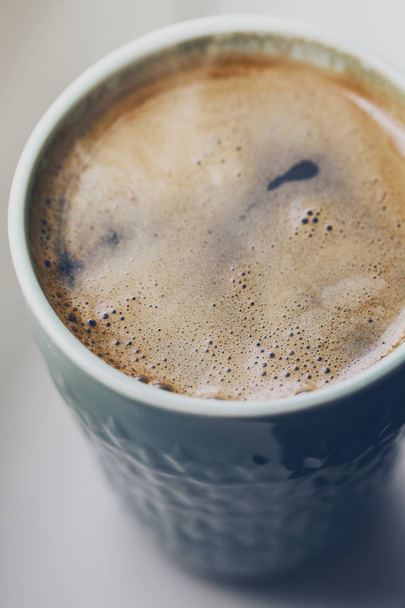 Closeup of tasty hot drink coffee espresso in ceramic mug - Foto, Imagem