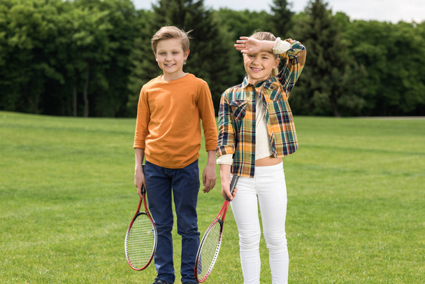 Kids with badminton racquets  - Foto, imagen