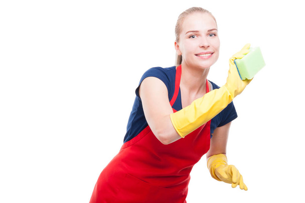 Jeune femme au foyer avec éponge nettoyage de la maison
 - Photo, image