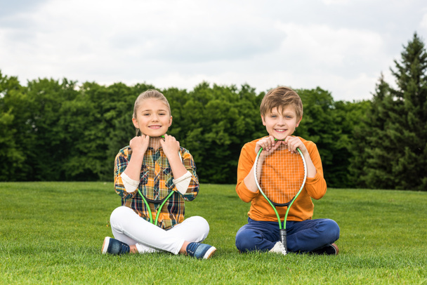 Kids with badminton racquets  - Fotografie, Obrázek