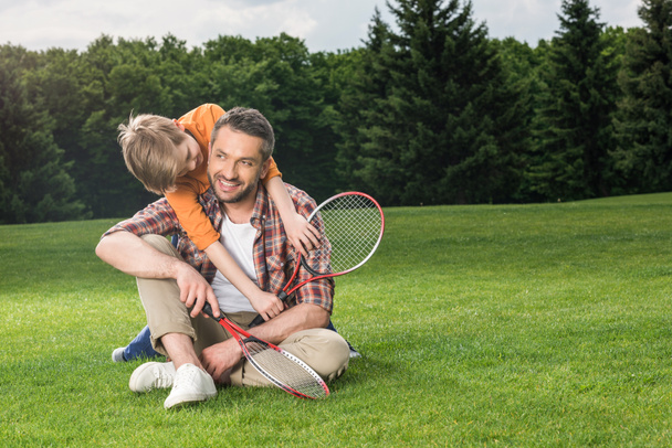 family with badminton racquets  - Foto, Bild