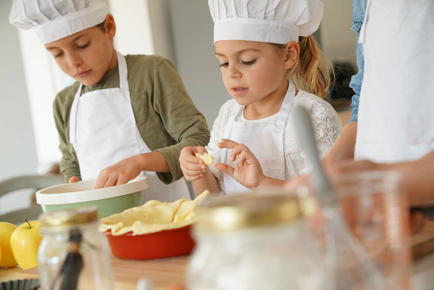 Kids in cooking class workshop  - Фото, изображение
