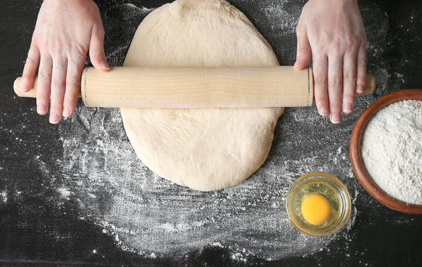 Female hands making dough for pizza - Foto, Imagem