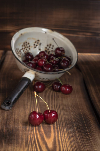 Cherry in a colander  - Photo, image