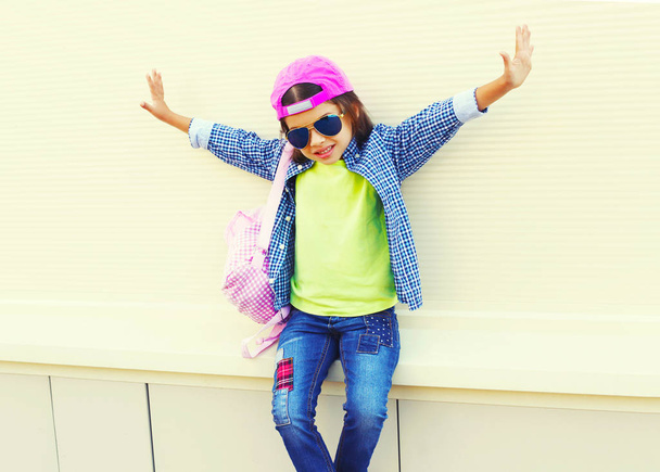 Fashion kid little girl having fun on a white background - Foto, Imagen