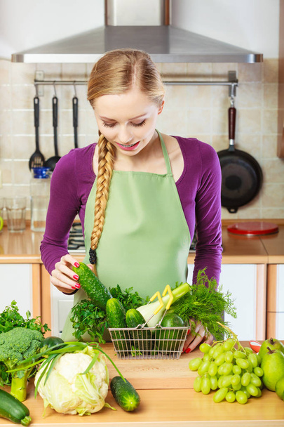 Woman having vegetables in shopping basket - Fotó, kép