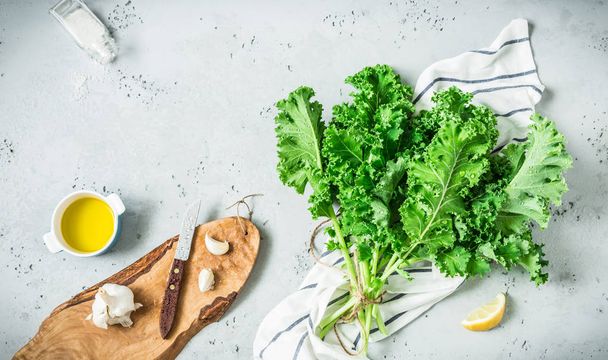 Kitchen - fresh kale leaves on worktop - cooking scenery - Photo, Image