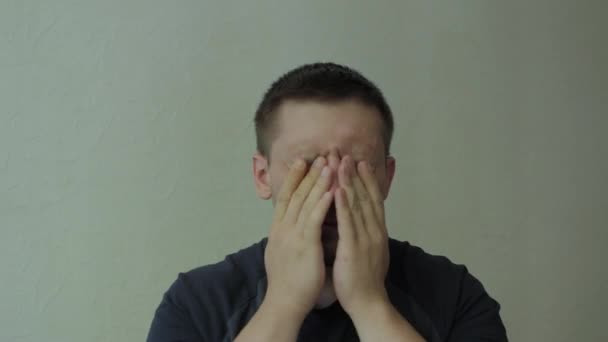 Tired man rubbing his face and eyes. - Záběry, video