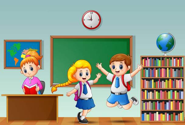 Happy school kids in a school uniform with female teacher at classroom - Vector, Image
