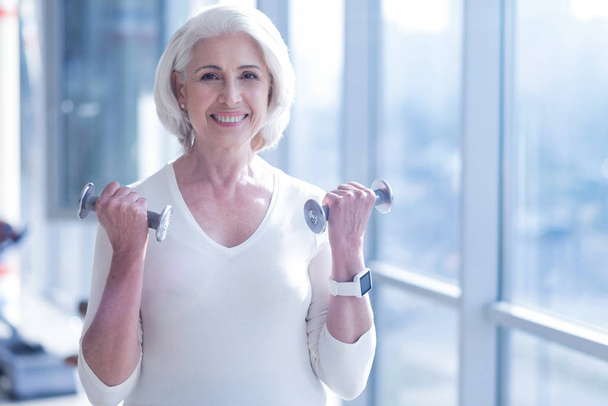 Happy old woman with dumbbells - Foto, Imagem