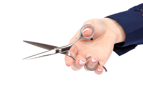 Professional hairdressing scissors in a female hand. - Photo, Image