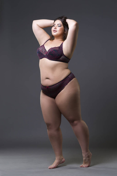 Plus size fashion model in underwear, young fat woman on gray background, overweight female body - Photo, image