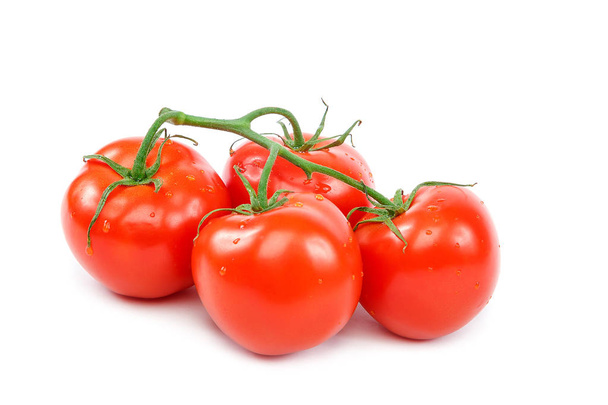Branch of a fresh red tomato on a white background. - Фото, зображення