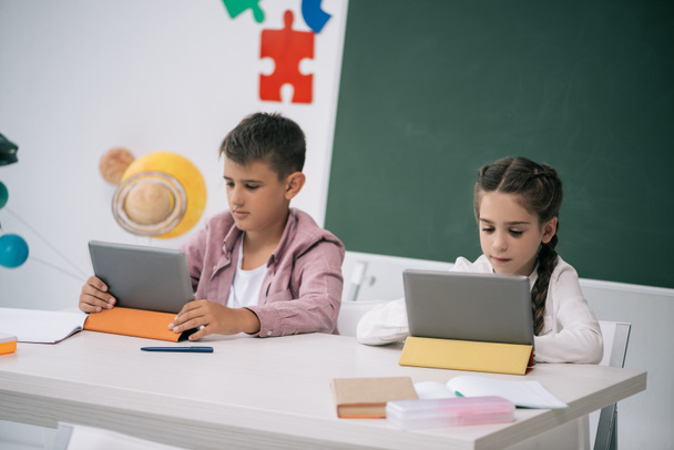 Schoolkids studying with digital tablets - Fotoğraf, Görsel