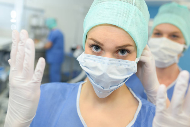 close-up portrait of female surgeon wearing protective mask - Foto, afbeelding