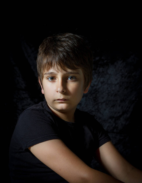 portrait of teen boy on black background - Foto, Bild
