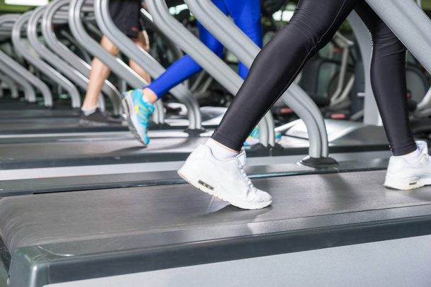 Close up of female legs on a treadmill  - Foto, Imagen