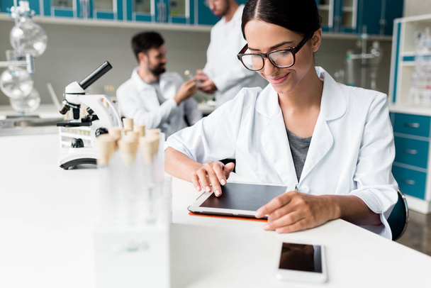 Scientist with digital tablet in lab  - Photo, Image