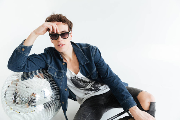 Young man near disco ball and boombox. - Foto, Imagem