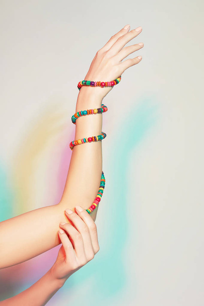 Female hand with bracelets - Фото, изображение