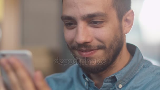 Hispanic Ethnicity Young Man using Mobile Phone at Cozy Coffee Shop. - Кадри, відео