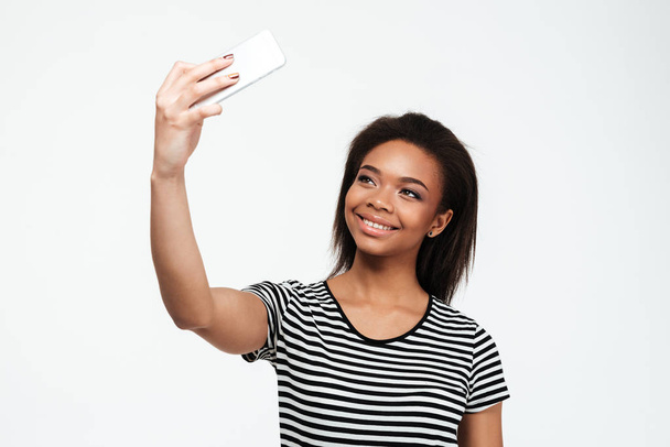 Happy young african lady make selfie by phone. - Zdjęcie, obraz