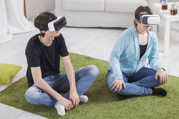 Virtual reality. Teens with virtual glasses are playing in the l - Fotó, kép