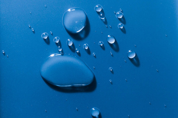 Large and small water droplets viewed from above - Photo, Image