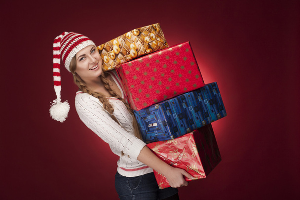 Mujeres con sombrero de Santa con regalos
 - Foto, imagen