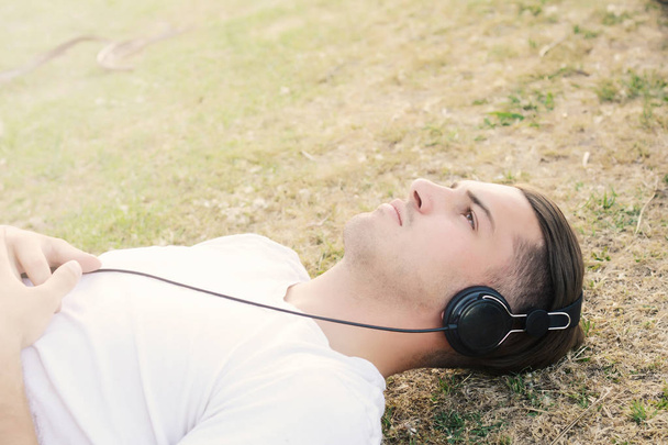 man listening to music with headphones. - Valokuva, kuva