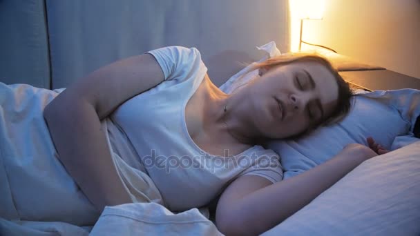 Woman having restless sleep waking up from nightmares - Footage, Video