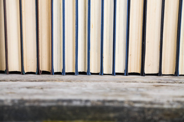 Stack of books on a blue background.  - Foto, Bild