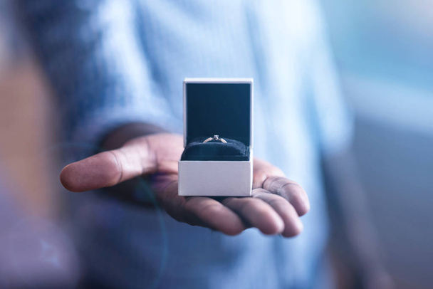 man demonstrating engagement ring - Fotó, kép