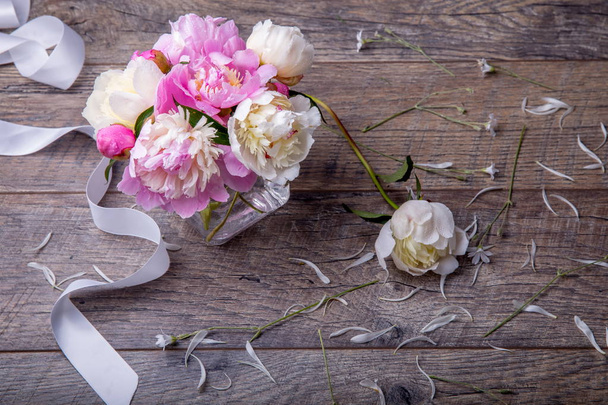 Stunning pink peonies on white rustic wooden background. Copy space - Foto, afbeelding