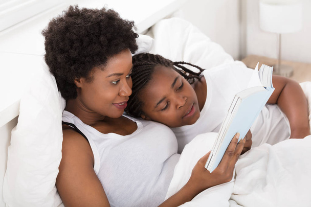 Mother Reading Bedtime Story  - Photo, image
