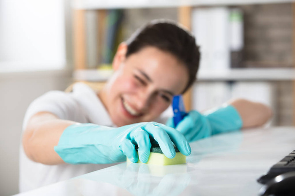 Woman Cleaning Desk In Office - Photo, Image