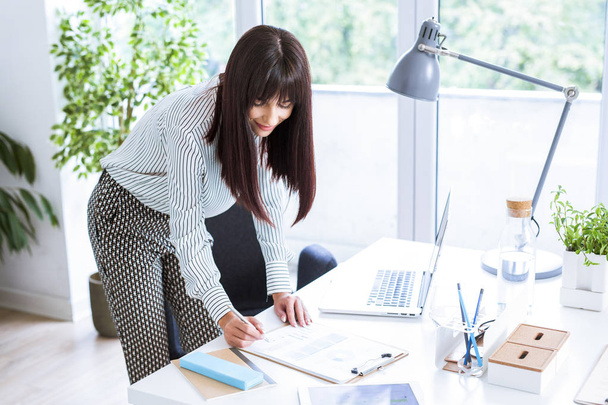 Businesswoman Working in Office - Photo, Image