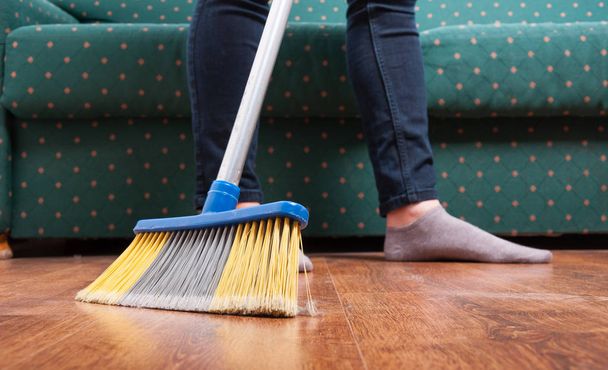 Cleaning woman sweeping wooden floor - Foto, Imagem